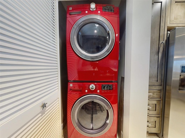 laundry area with stacked washer and dryer