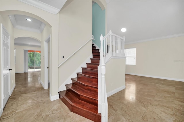 staircase with crown molding and tile floors