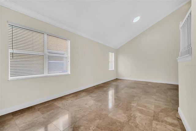 tiled empty room with vaulted ceiling and ornamental molding