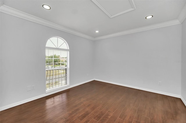 empty room featuring dark hardwood / wood-style floors and crown molding