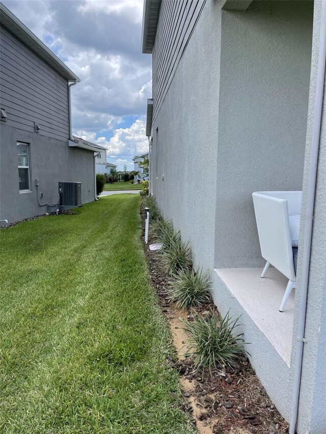 view of yard featuring central AC unit