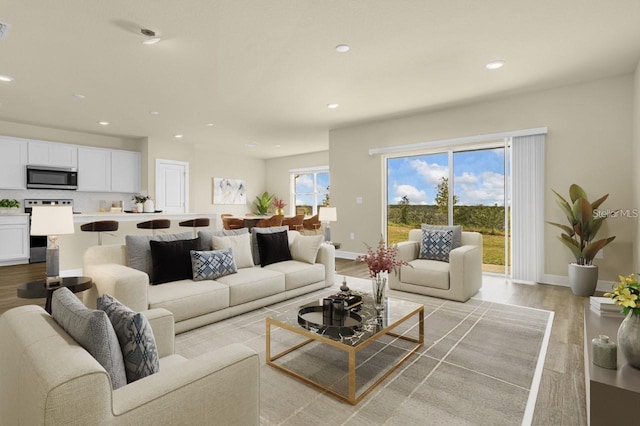 living room featuring a wealth of natural light and light wood-type flooring