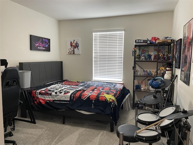 bedroom with multiple windows and carpet