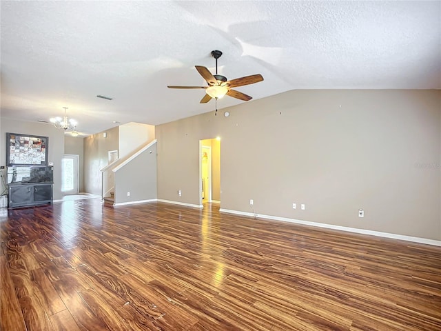 unfurnished living room with a textured ceiling, lofted ceiling, ceiling fan with notable chandelier, and dark hardwood / wood-style floors