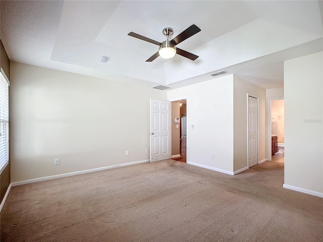 carpeted empty room with a textured ceiling and ceiling fan