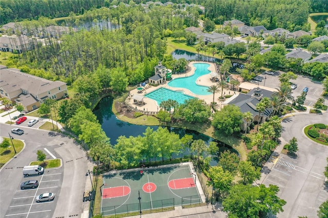 birds eye view of property with a water view