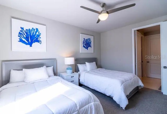 carpeted bedroom featuring ceiling fan