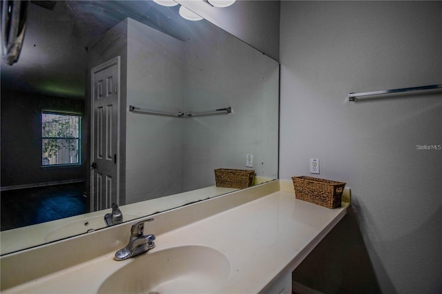 bathroom featuring vanity with extensive cabinet space