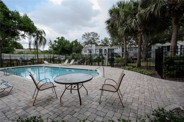 view of pool featuring a patio