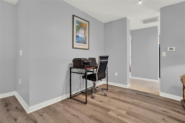 home office with light tile flooring