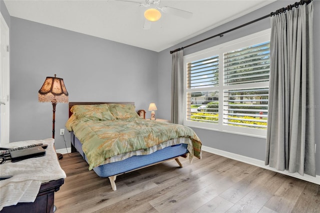 bedroom featuring hardwood / wood-style floors and ceiling fan