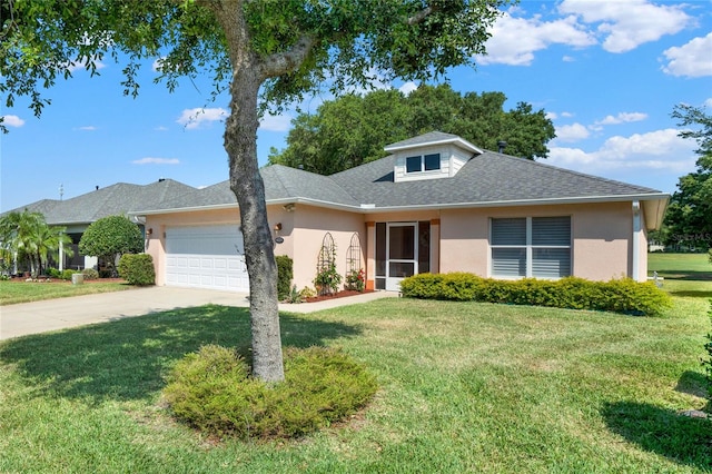 view of front of house with a garage and a front lawn