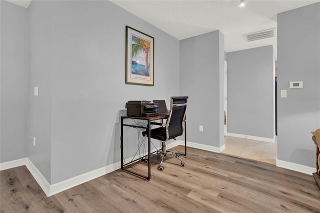 home office featuring light hardwood / wood-style floors