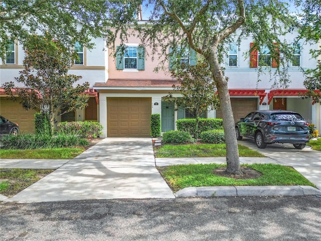 multi unit property featuring a garage