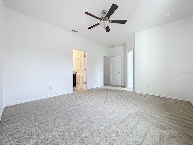 interior space featuring ceiling fan and light colored carpet