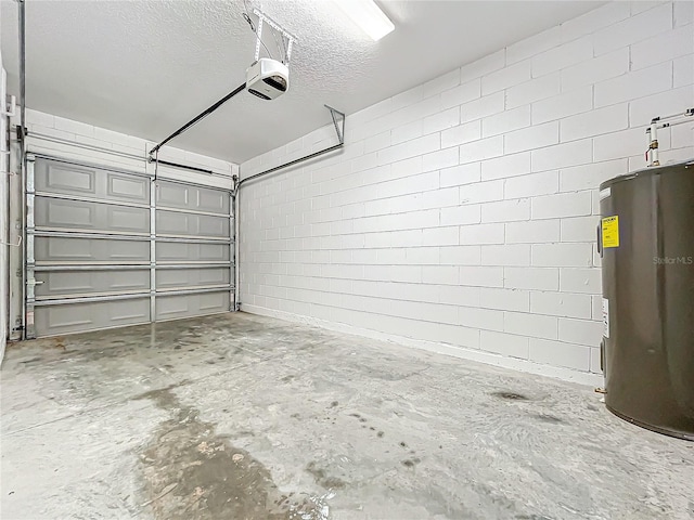 garage with a garage door opener and electric water heater