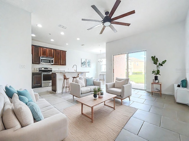 tiled living room featuring ceiling fan