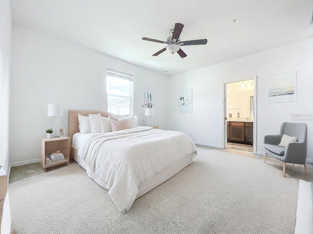 carpeted bedroom featuring ceiling fan and connected bathroom