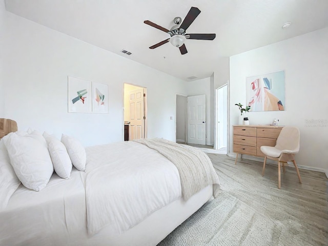 bedroom with ceiling fan and hardwood / wood-style flooring