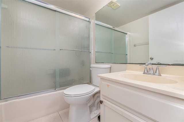 full bathroom with vanity with extensive cabinet space, enclosed tub / shower combo, toilet, and tile floors