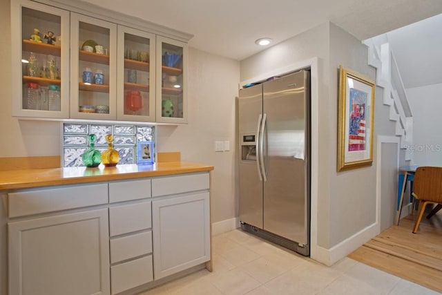 kitchen with stainless steel fridge and light hardwood / wood-style flooring