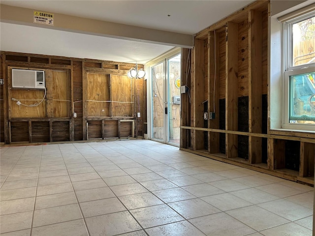 misc room with a chandelier and a wall mounted air conditioner