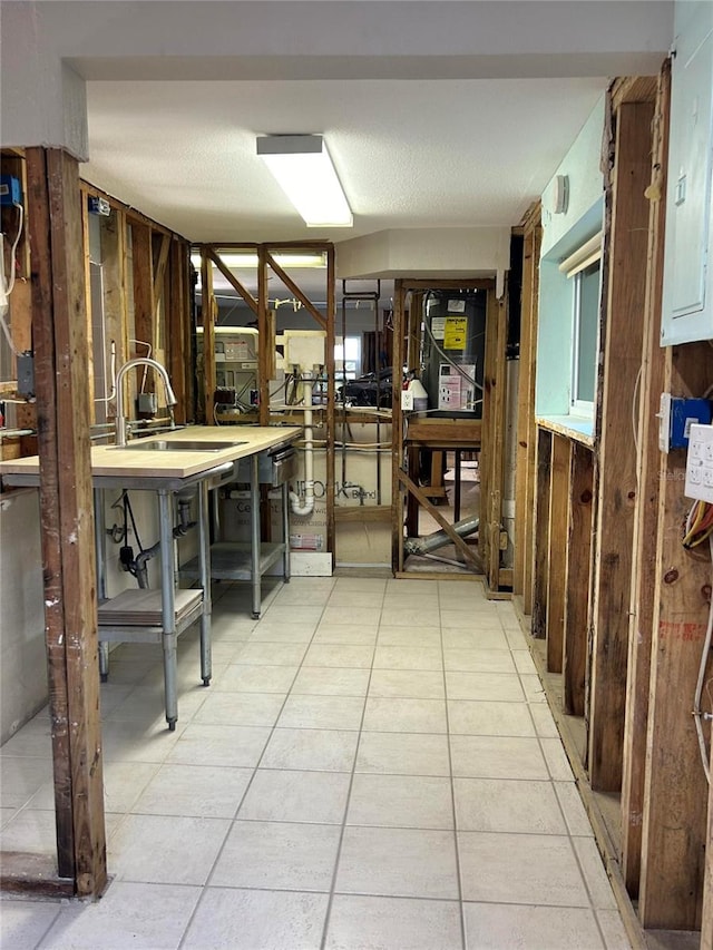 kitchen with light tile patterned floors and sink