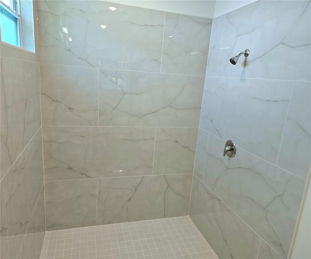 bathroom with tiled shower