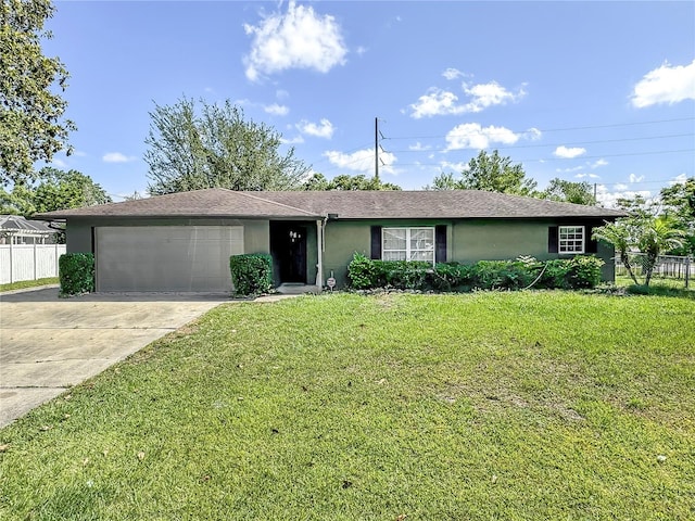 ranch-style home featuring a garage and a front yard