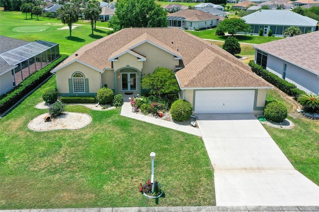 view of front of house with a garage and a front yard