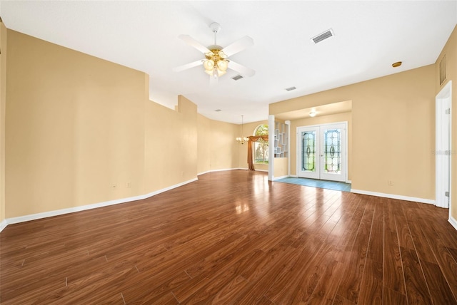 unfurnished living room featuring ceiling fan, french doors, and hardwood / wood-style floors