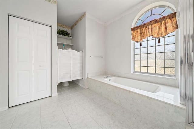 bathroom with tiled bath and tile floors