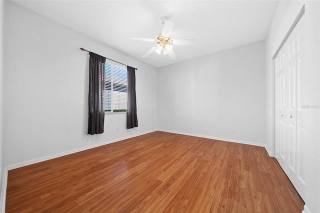 unfurnished room featuring wood-type flooring and ceiling fan