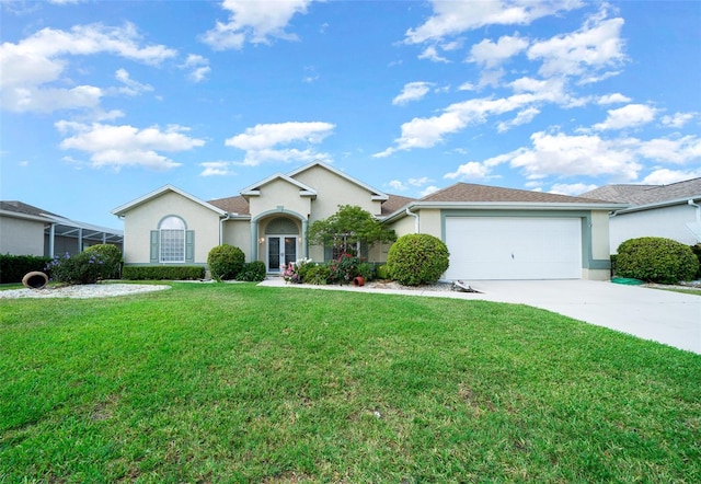 ranch-style house featuring a garage and a front yard