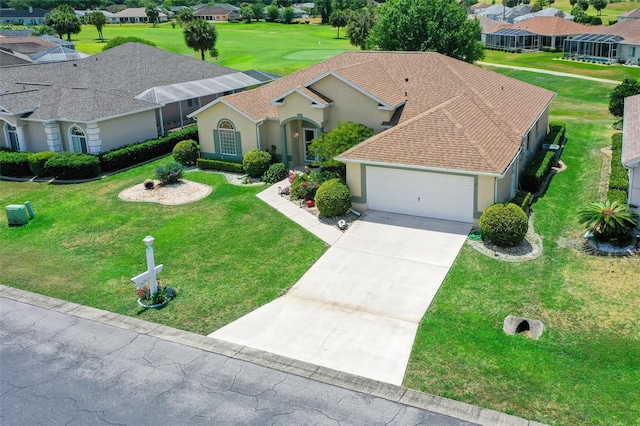 view of front of property featuring a garage and a front yard