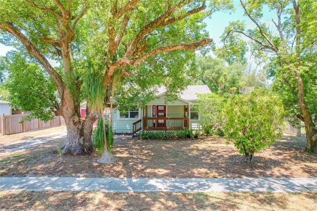 obstructed view of property with covered porch