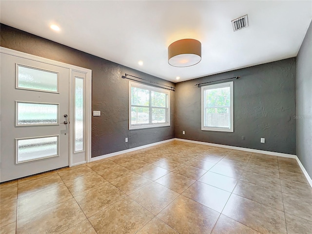 entrance foyer with light tile patterned floors