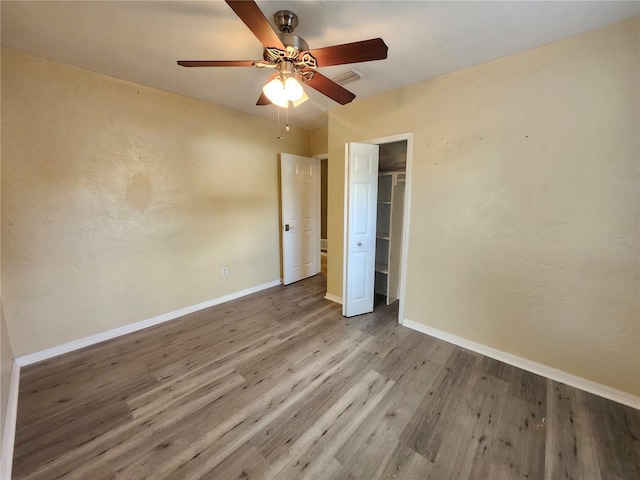 unfurnished bedroom with light hardwood / wood-style floors and ceiling fan