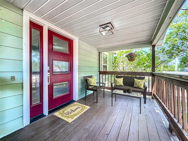 wooden deck featuring covered porch