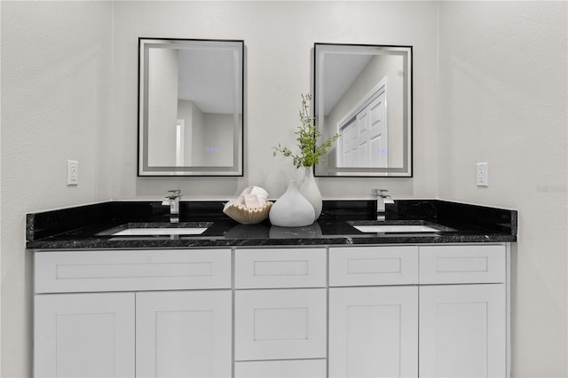 bathroom with double vanity and a sink