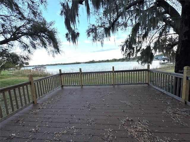 wooden deck featuring a water view