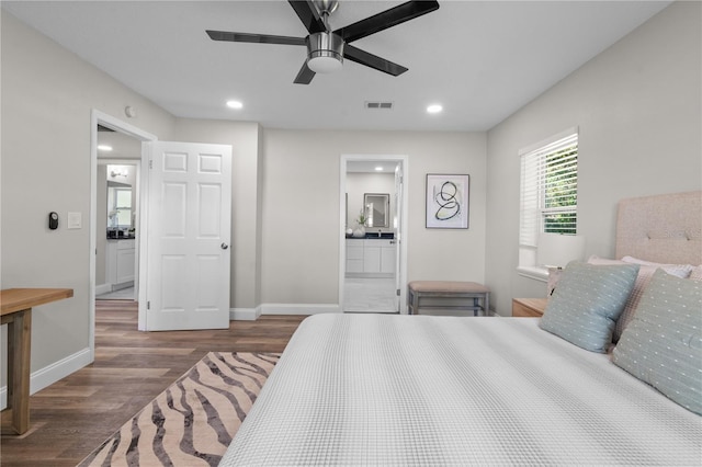 bedroom featuring baseboards, visible vents, wood finished floors, and recessed lighting