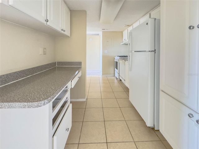 kitchen with white cabinets, white appliances, and light tile patterned floors