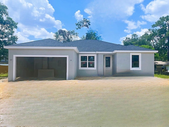 single story home with a garage