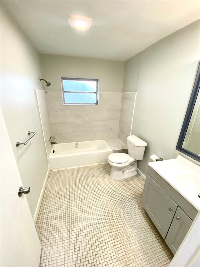 full bathroom with tiled shower / bath combo, toilet, tile flooring, and vanity