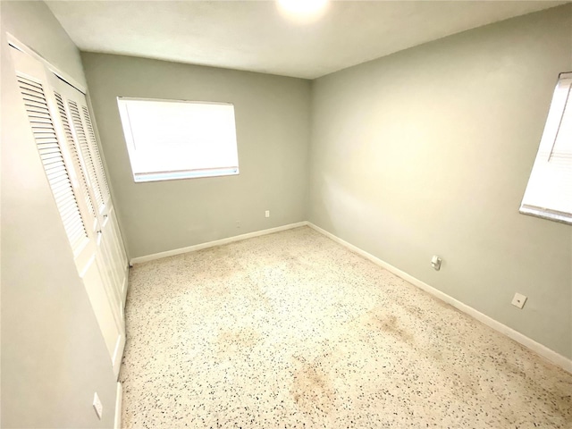 spare room featuring a wealth of natural light