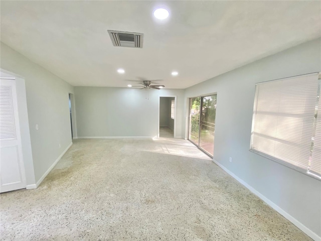 unfurnished room with ceiling fan