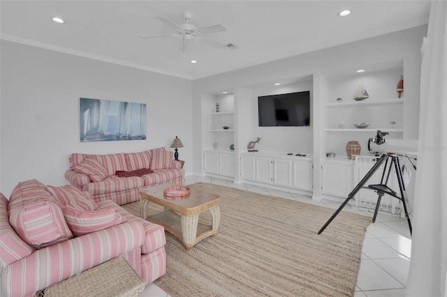 living room featuring built in features, ornamental molding, ceiling fan, and light tile flooring