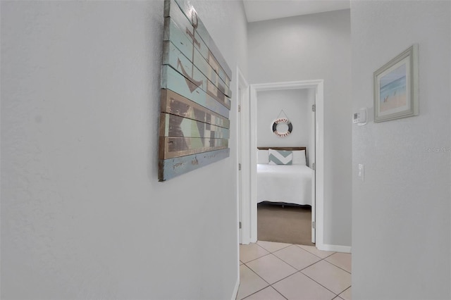 hallway featuring light tile flooring