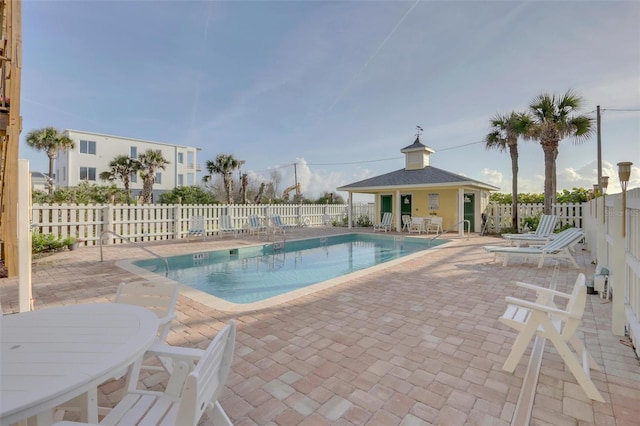 view of swimming pool featuring a patio